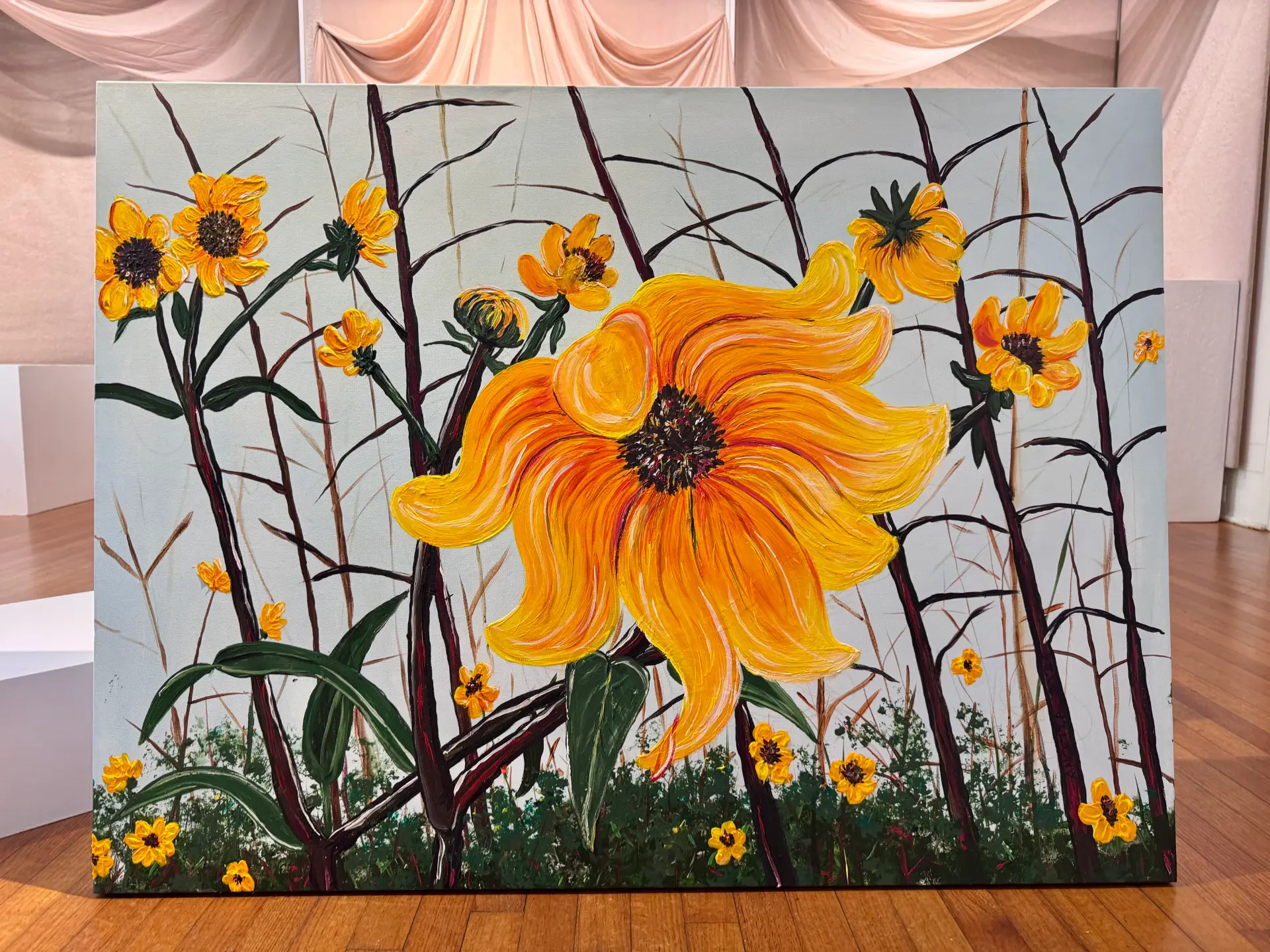 Painting of one large golden flower among dark upright stems and smaller yellow blooms against a pale sky